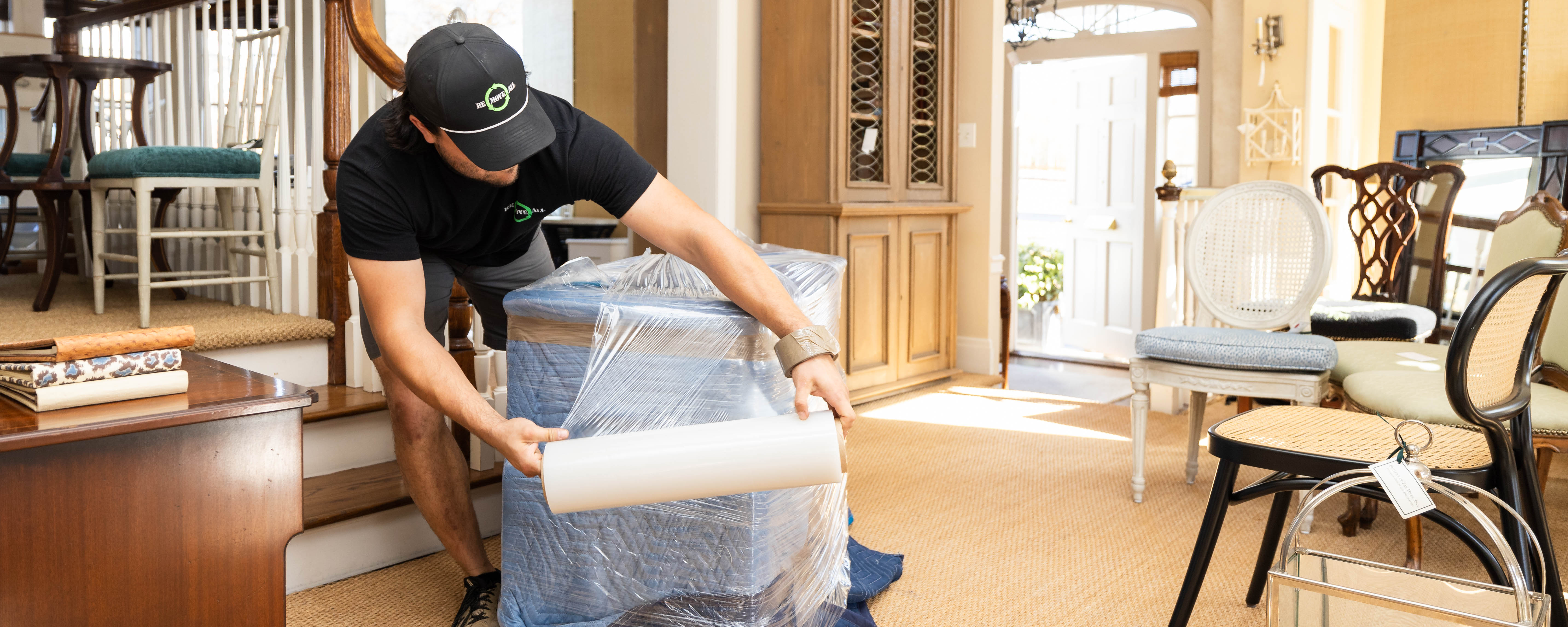 Experienced concierge movers for Re-Move-All packing and securing an item for move